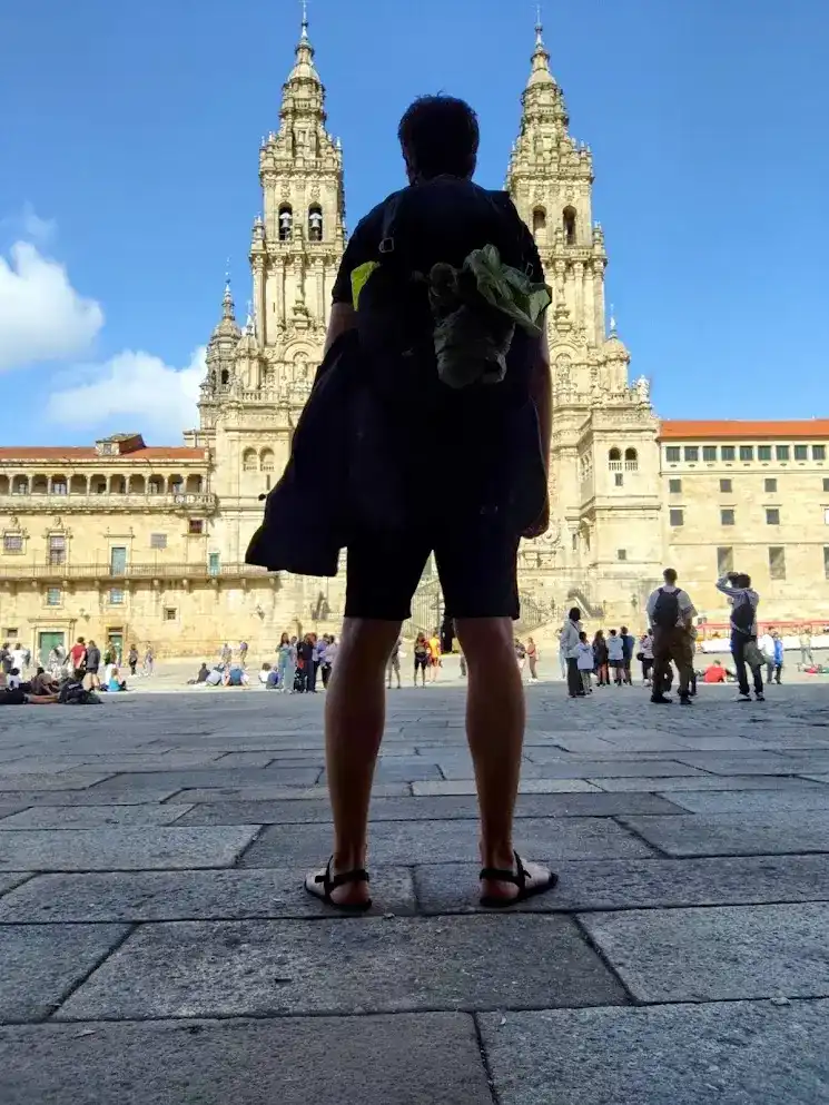 Michiel Das in front of Santiago Cathedral after completing the Camino Portugués Coastal Route